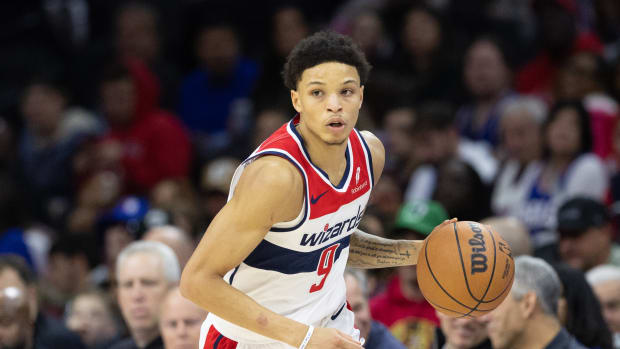 Washington Wizards guard Ryan Rollins (9) dribbles the ball against the Philadelphia 76ers during the fourth quarter at Wells Fargo Center.